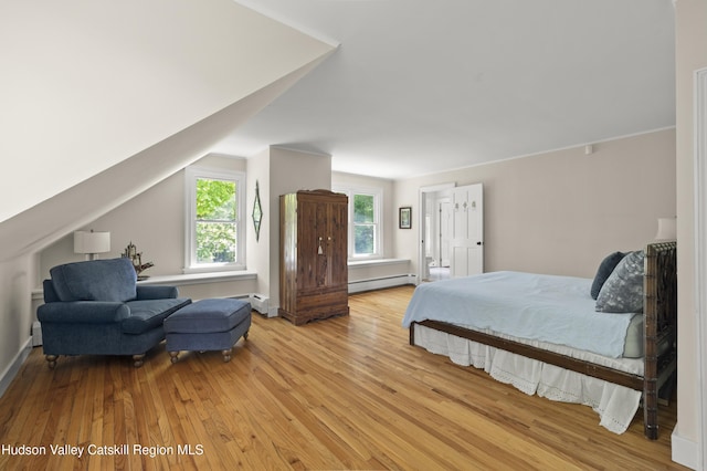 202 Buckwheat Bridge Rd, Germantown, NY 12526 - bedroom with a baseboard radiator, light wood-style floors, and vaulted ceiling