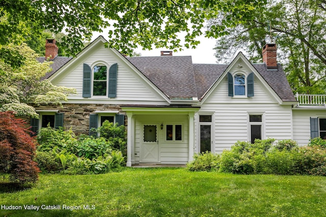 202 Buckwheat Bridge Rd, Germantown, NY 12526 - view of front of house featuring a chimney, a front yard, and roof with shingles