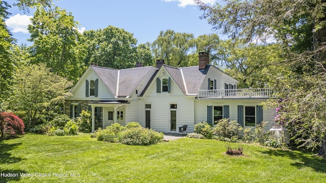 202 Buckwheat Bridge Rd, Germantown, NY 12526 - rear view of house featuring a chimney, a lawn, and a balcony