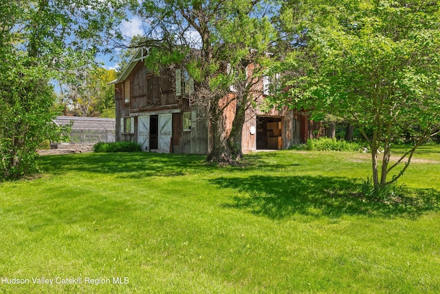 202 Buckwheat Bridge Rd, Germantown, NY 12526 - view of green lawn with a barn and an outdoor structure