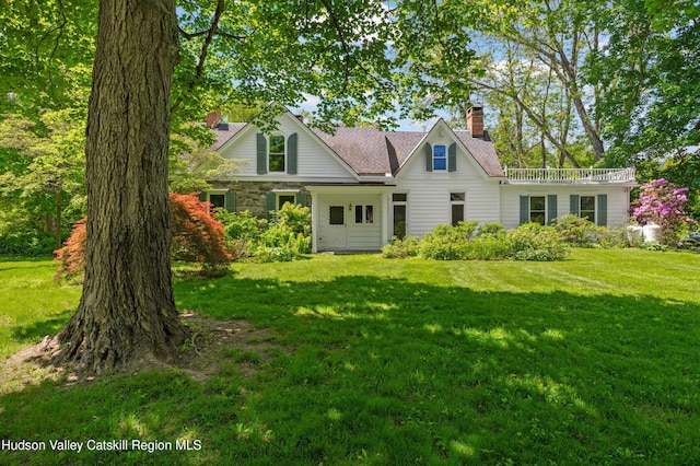 202 Buckwheat Bridge Rd, Germantown, NY 12526 - view of front of house featuring a chimney, a front lawn, and stone siding