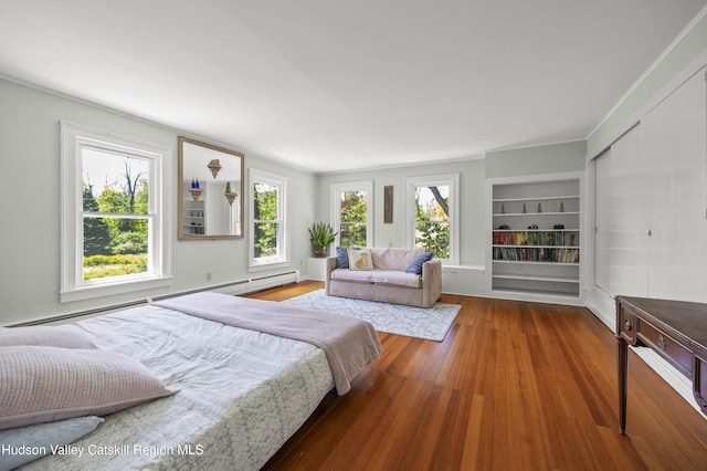 202 Buckwheat Bridge Rd, Germantown, NY 12526 - bedroom with wood finished floors and baseboard heating