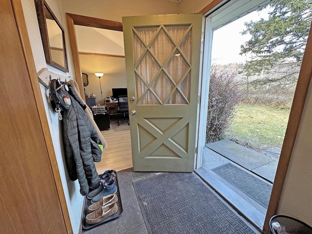 doorway to outside with tile patterned floors