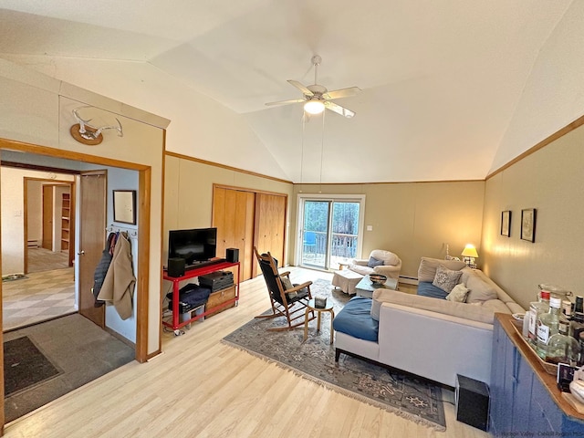 living room with ceiling fan, vaulted ceiling, and wood-type flooring