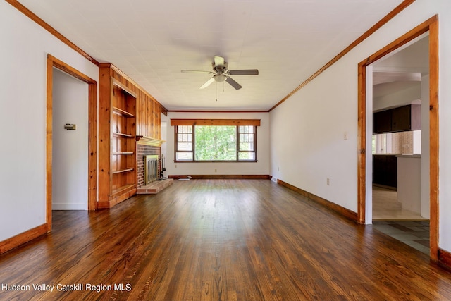 unfurnished living room featuring ceiling fan, a fireplace, dark hardwood / wood-style floors, and ornamental molding