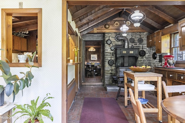 1716 Rte 212, Saugerties, NY 12477 - wine room with wallpapered walls, wooden ceiling, a wood stove, and brick floors