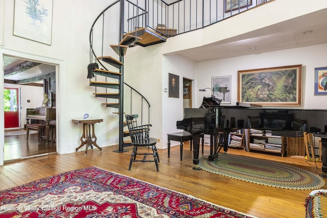 1716 Rte 212, Saugerties, NY 12477 - living area featuring a high ceiling, wood-type flooring, and stairway