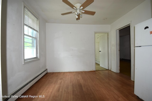 2693 Rte 9w, Saugerties, NY 12477 - spare room featuring baseboard heating, wood finished floors, and a ceiling fan