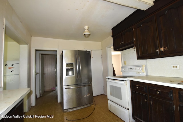 2693 Rte 9w, Saugerties, NY 12477 - kitchen with stainless steel fridge, electric range, light countertops, and dark brown cabinetry