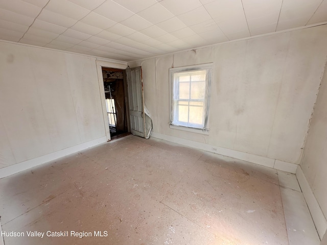spare room featuring baseboards