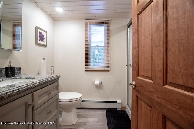 50 Tempaloni Rd, Ellenville, NY 12428 - bathroom with a baseboard heating unit, vanity, toilet, a shower with shower door, and baseboards
