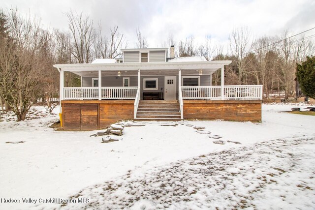 50 Tempaloni Rd, Ellenville, NY 12428 - view of front of house with covered porch and a chimney