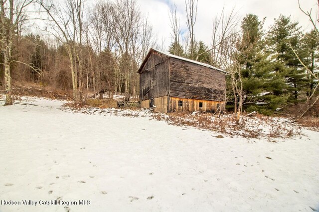 50 Tempaloni Rd, Ellenville, NY 12428 - view of snow covered exterior featuring a barn and an outdoor structure