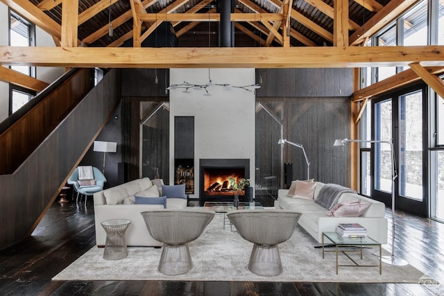 890 Bald Mountain Rd, Austerlitz, NY 12017 - living room with high vaulted ceiling, hardwood / wood-style floors, a lit fireplace, and beam ceiling