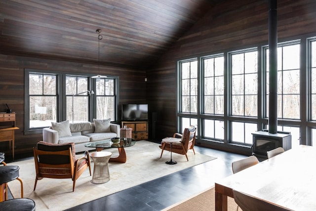 890 Bald Mountain Rd, Austerlitz, NY 12017 - living room with vaulted ceiling, plenty of natural light, a wood stove, wooden walls, and wood ceiling