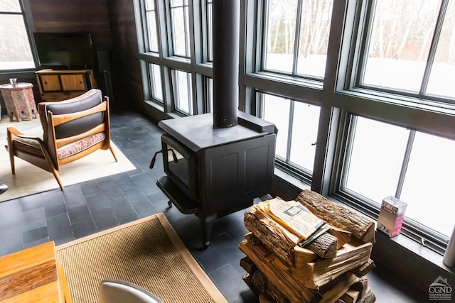 890 Bald Mountain Rd, Austerlitz, NY 12017 - living room featuring a wood stove and dark tile patterned flooring