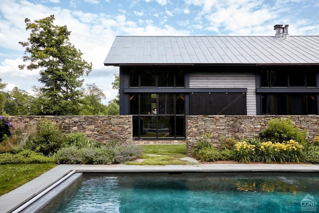 890 Bald Mountain Rd, Austerlitz, NY 12017 - rear view of house with an outdoor pool and stone siding