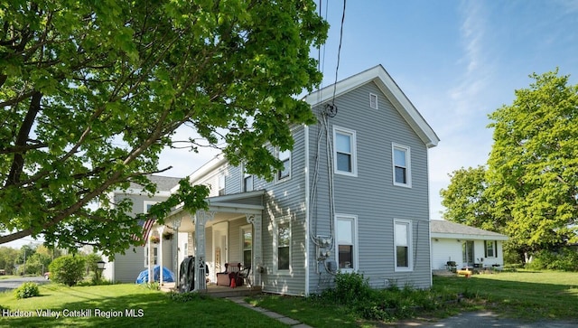 1300 S Schodack Rd, Castleton, NY 12033 - view of front facade with a porch and a front lawn