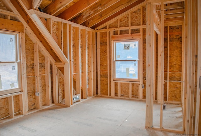 miscellaneous room featuring a healthy amount of sunlight and vaulted ceiling