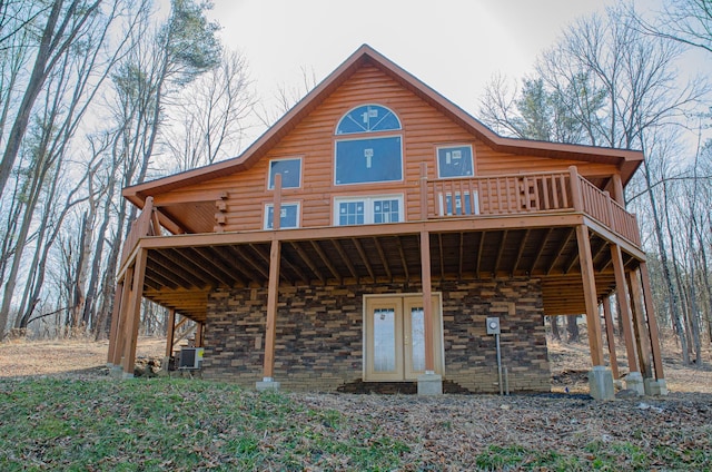 rear view of property featuring french doors