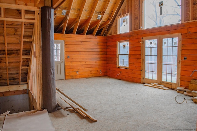 misc room with french doors, plenty of natural light, and vaulted ceiling