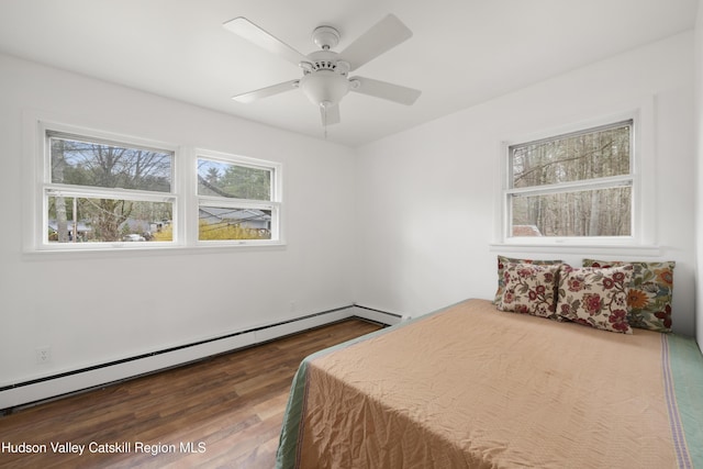 146 Sherman Rd, Kingston, NY 12401 - bedroom with a baseboard radiator, a ceiling fan, and dark wood-type flooring