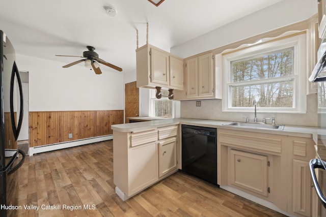 146 Sherman Rd, Kingston, NY 12401 - kitchen featuring ceiling fan, a sink, a wainscoted wall, a baseboard radiator, and black appliances