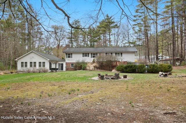 146 Sherman Rd, Kingston, NY 12401 - back of house with an outdoor fire pit, a wooden deck, and a yard
