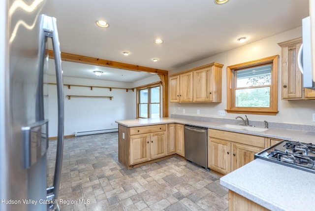 kitchen featuring kitchen peninsula, light brown cabinetry, stainless steel appliances, baseboard heating, and sink