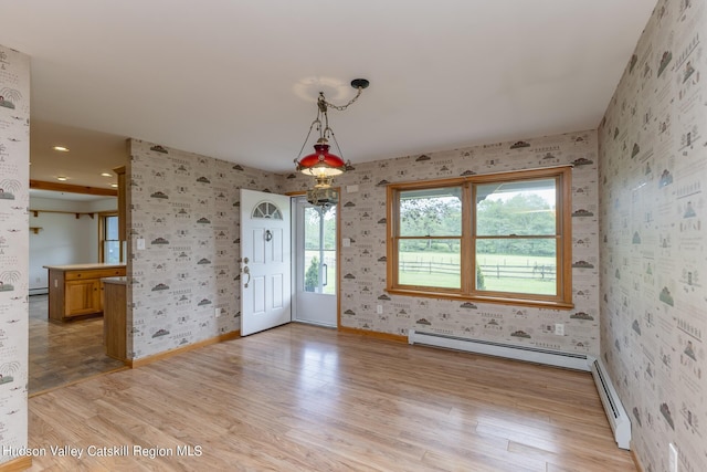 interior space featuring a baseboard radiator and light wood-type flooring