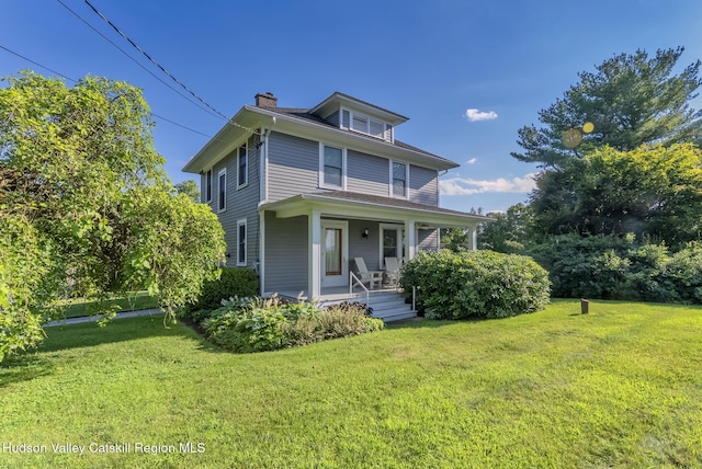 280 Pitcher Ln, Red Hook, NY 12571 - traditional style home featuring covered porch, a chimney, and a front yard