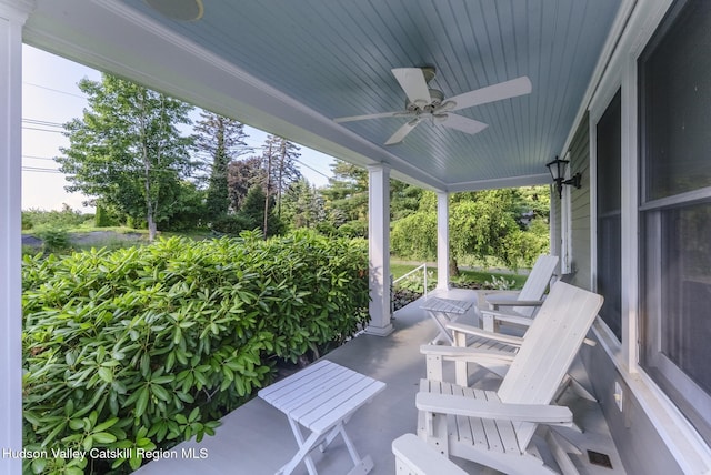 280 Pitcher Ln, Red Hook, NY 12571 - covered porch with ceiling fan and view of scattered trees