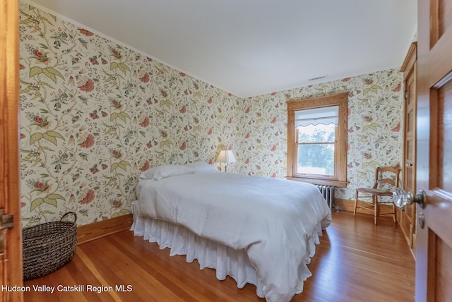 280 Pitcher Ln, Red Hook, NY 12571 - bedroom featuring wallpapered walls, light wood finished floors, and radiator