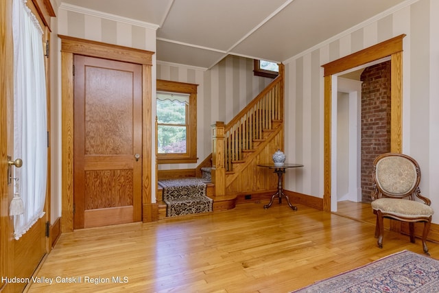 280 Pitcher Ln, Red Hook, NY 12571 - entrance foyer featuring light wood-style floors, stairs, ornamental molding, and wallpapered walls