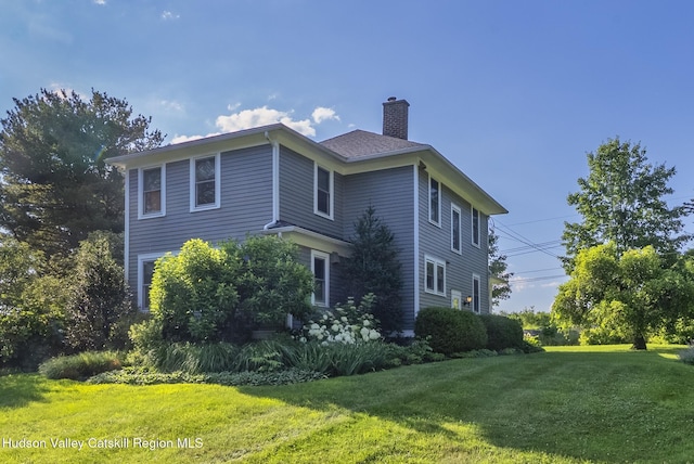 280 Pitcher Ln, Red Hook, NY 12571 - view of property exterior featuring a chimney and a yard