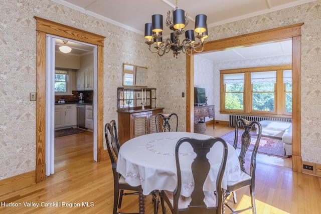 280 Pitcher Ln, Red Hook, NY 12571 - dining space featuring light wood-type flooring, radiator heating unit, wallpapered walls, a chandelier, and ornamental molding
