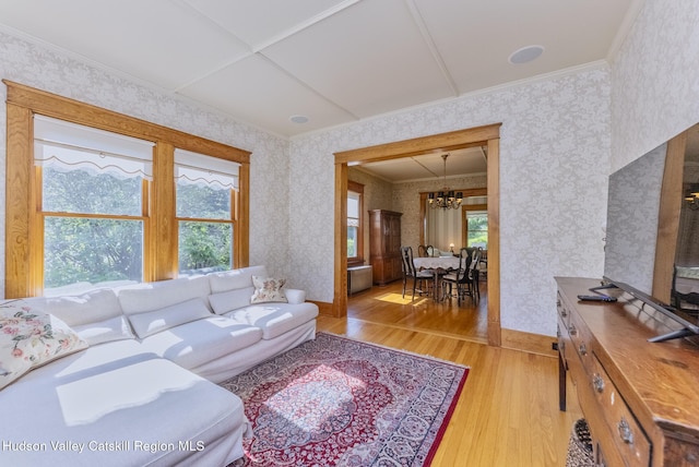 280 Pitcher Ln, Red Hook, NY 12571 - living area featuring light wood-style floors, wallpapered walls, a chandelier, and ornamental molding