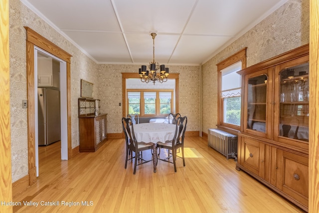 280 Pitcher Ln, Red Hook, NY 12571 - dining space featuring radiator, a chandelier, light wood finished floors, wallpapered walls, and crown molding