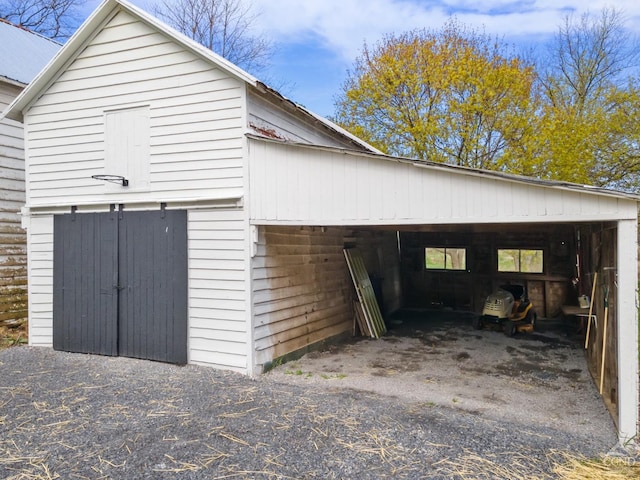 143 Grand St, Schoharie, NY 12157 - view of side of home with an outdoor structure and a carport