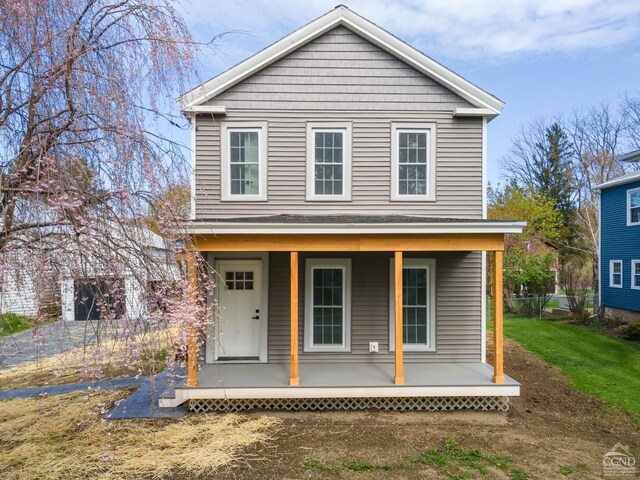 143 Grand St, Schoharie, NY 12157 - view of front of house featuring a porch and fence