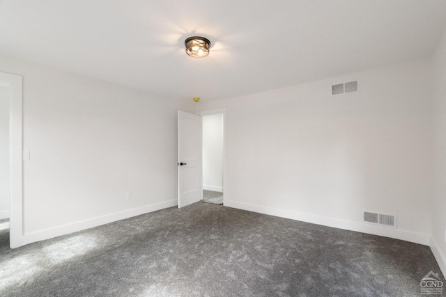 143 Grand St, Schoharie, NY 12157 - empty room featuring dark colored carpet and baseboards