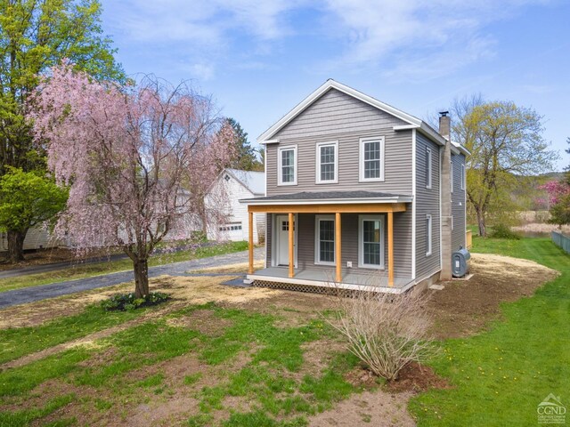 143 Grand St, Schoharie, NY 12157 - view of front of house featuring a porch and a chimney