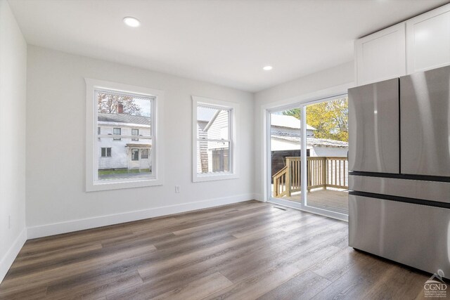 143 Grand St, Schoharie, NY 12157 - unfurnished dining area with dark wood-type flooring, recessed lighting, and baseboards