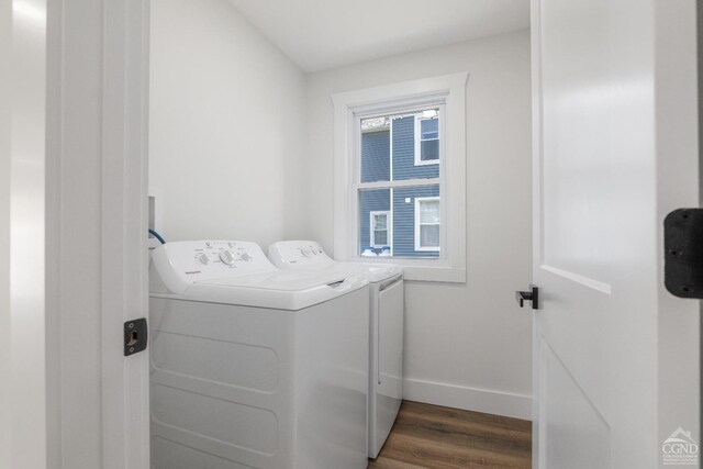 143 Grand St, Schoharie, NY 12157 - washroom featuring washing machine and dryer, baseboards, and wood finished floors