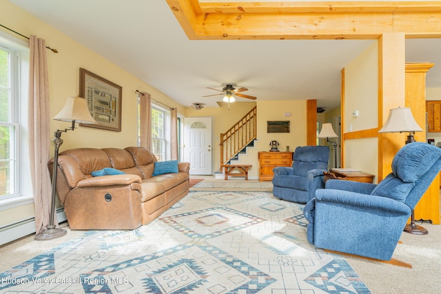 living room with ceiling fan, plenty of natural light, and carpet