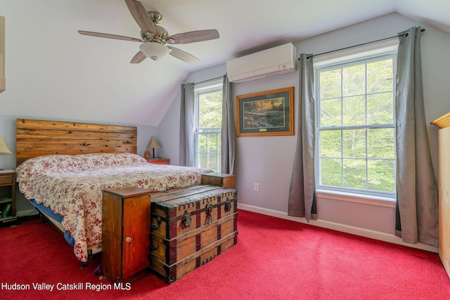 carpeted bedroom with vaulted ceiling, a wall unit AC, and ceiling fan