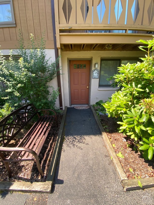 75 Highlands Dr Unit T-4, Hunter, NY 12442 - view of exterior entry featuring stucco siding