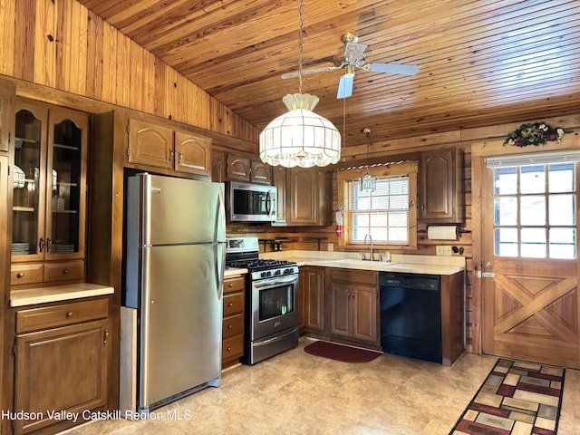 29 Fallen Tree Ln, Athens, NY 12015 - kitchen featuring stainless steel appliances, lofted ceiling, wood ceiling, light countertops, and a sink