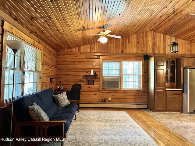 29 Fallen Tree Ln, Athens, NY 12015 - living area with lofted ceiling, wood walls, a baseboard heating unit, ceiling fan, and wooden ceiling