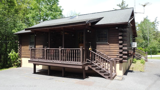 29 Fallen Tree Ln, Athens, NY 12015 - rear view of property featuring log exterior, stairs, and roof with shingles